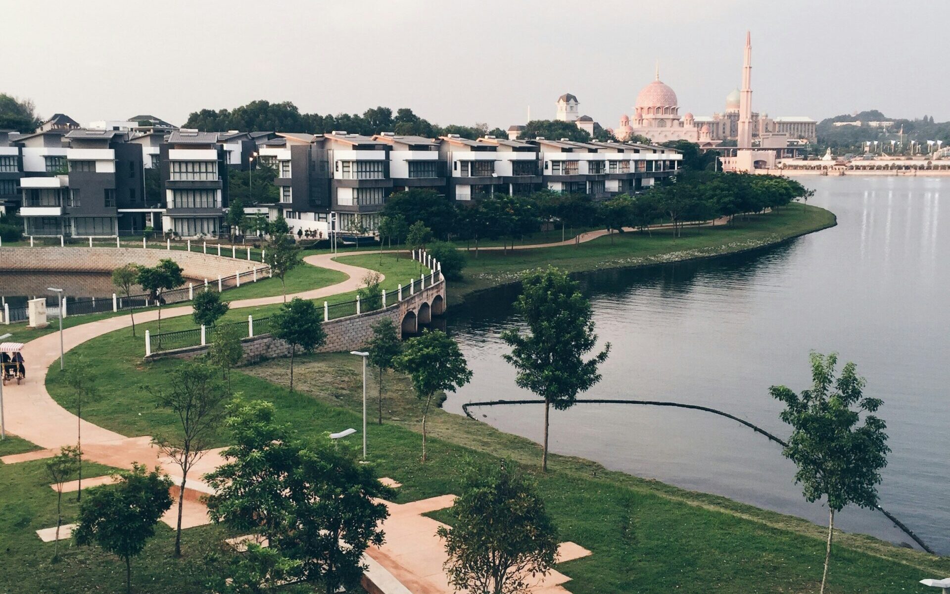 Scenic view of a modern family-friendly township in the Klang Valley featuring landscaped parks, playgrounds, and guarded residential houses.